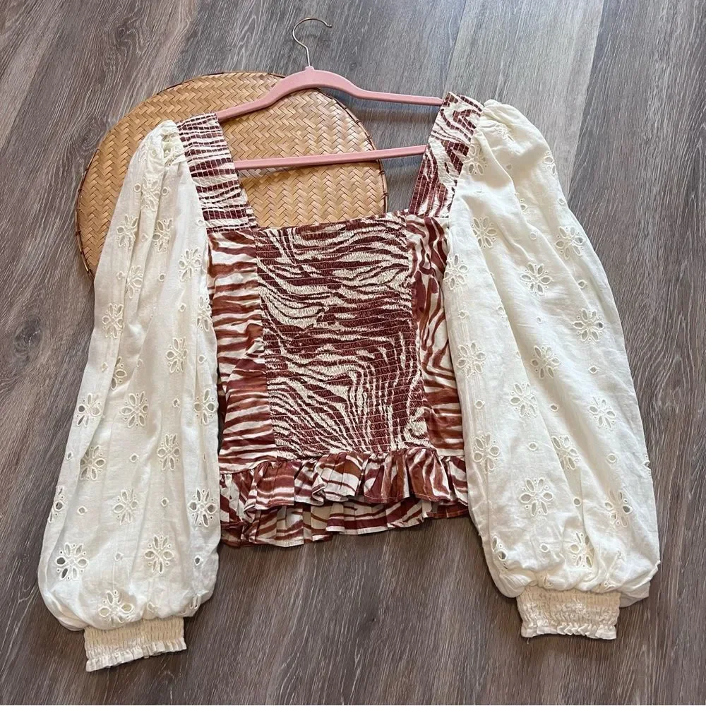 Anthropologie love the‎ label zebra laser cut puff sleeve smocked blouse